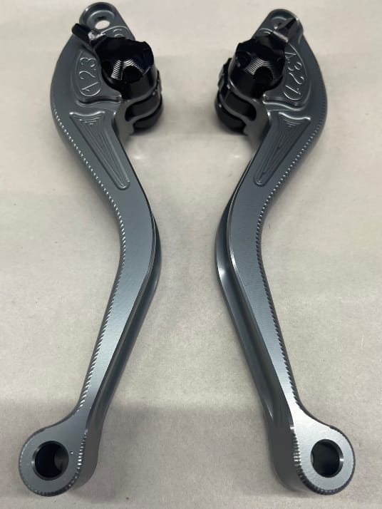 Custom CNC machined aluminum levers with matte grey anodized finish and black adjustable knobs.